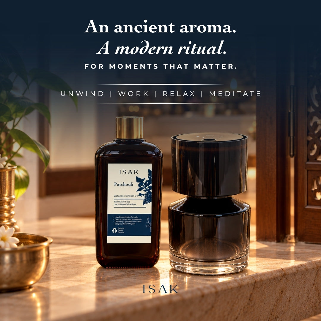 Cordless aroma diffuser with stacked dark body and patchouli oil bottle on counter