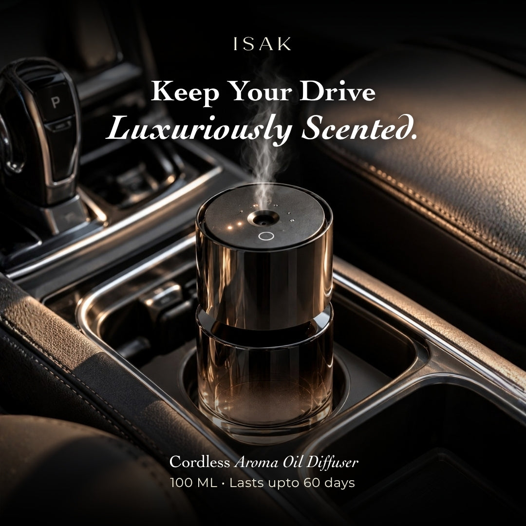 Isak cordless aroma oil diffuser in car, glossy black top and base with vapor