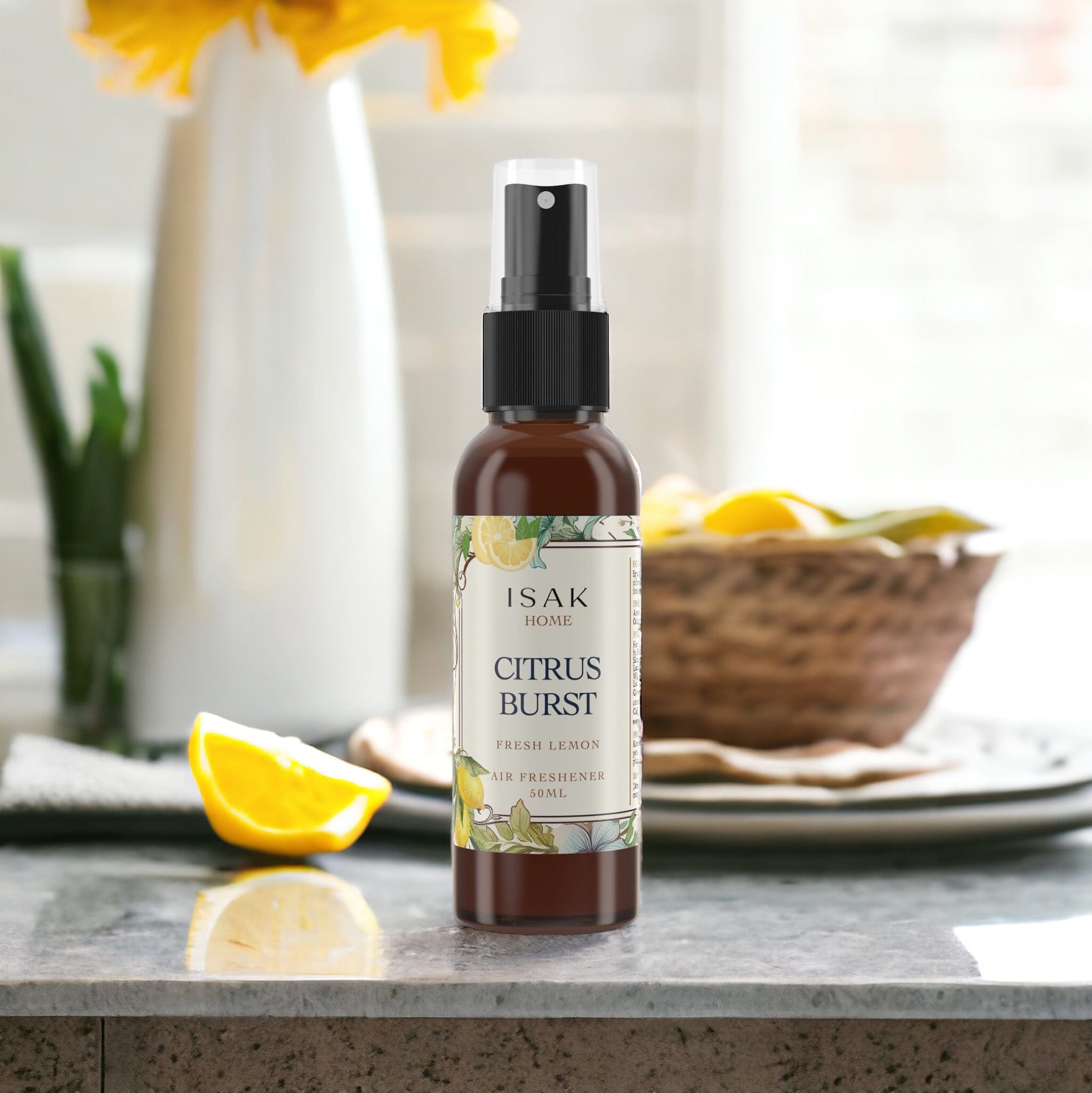 Citrus Burst air freshener spray bottle with lemon wedges beside it on a counter