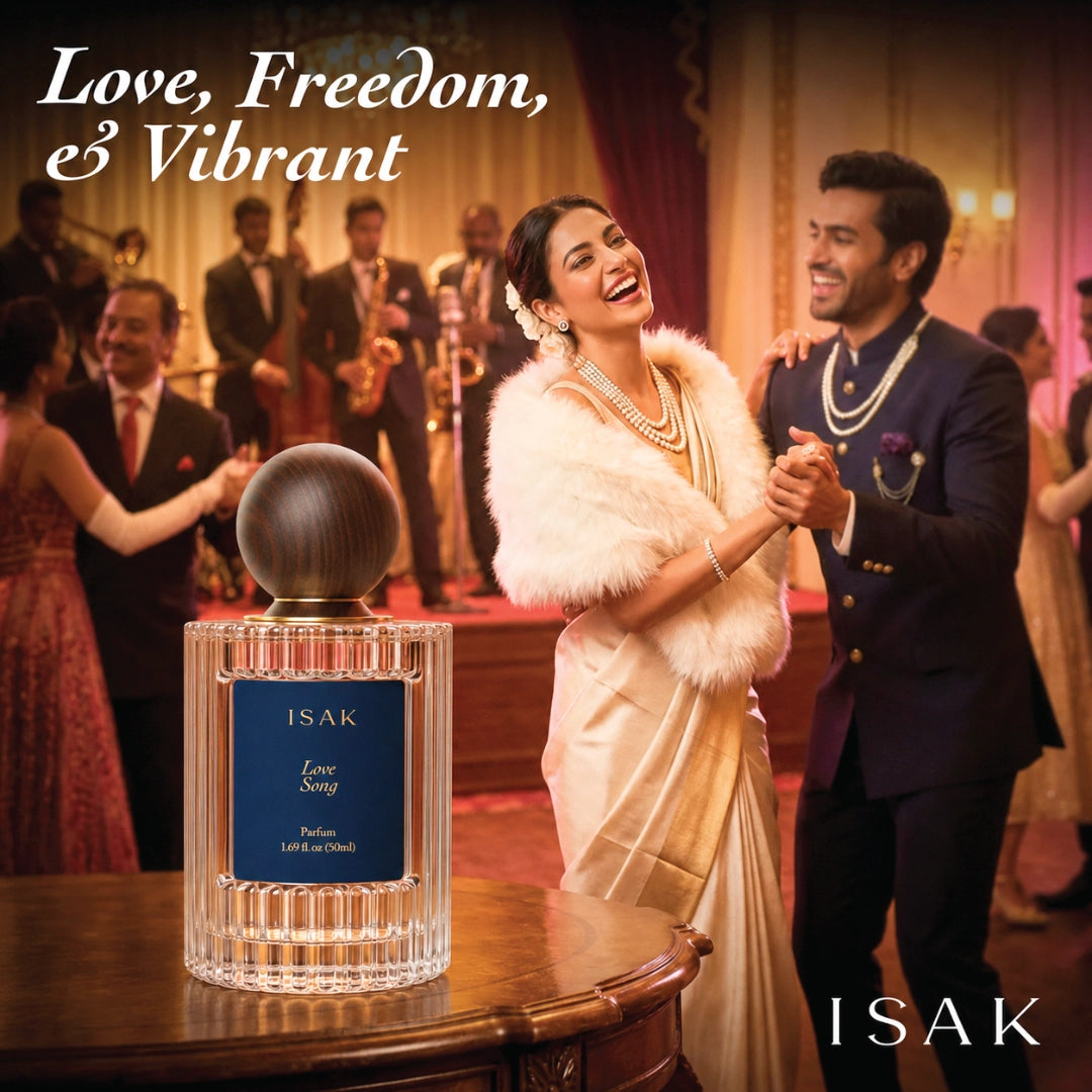 ISAK perfume bottle on table, dark sphere cap and silver ribbed glass.
