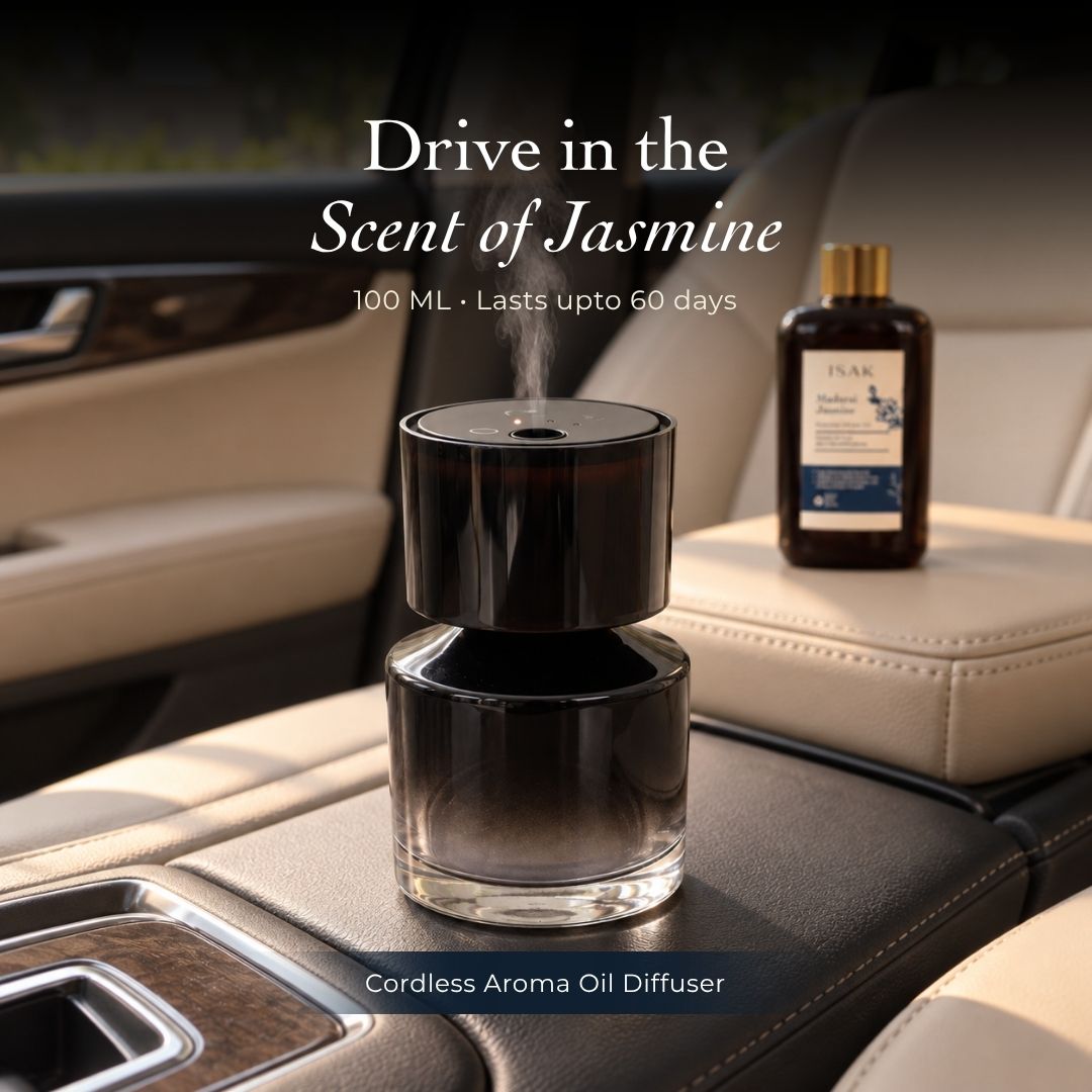 Cordless aroma oil diffuser with dark glass base and jasmine fragrance oil bottle