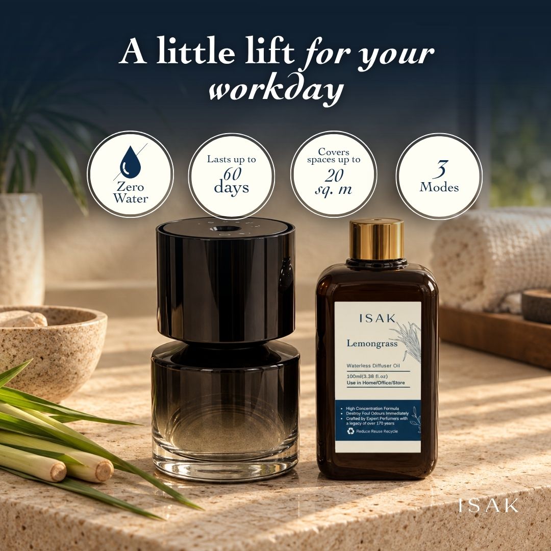 Cordless aroma diffuser and lemongrass fragrance oil bottle on tabletop, black and clear