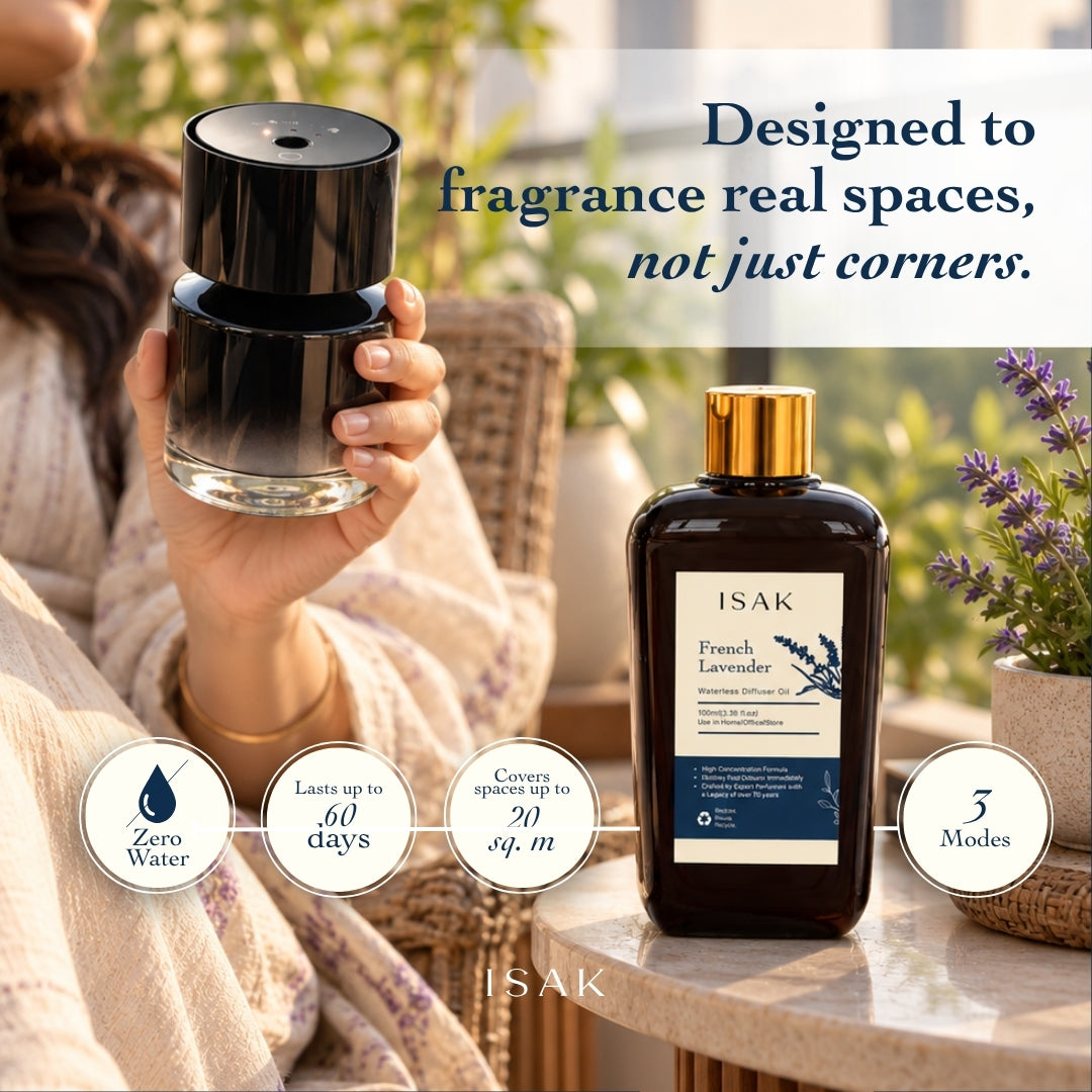 Cordless aroma diffuser with black top and clear glass base, with lavender fragrance oil bottle