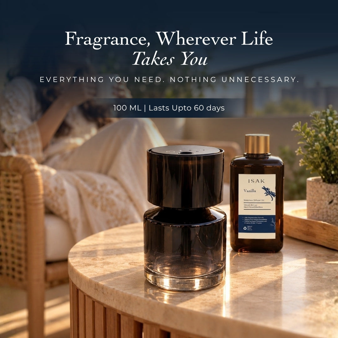 Cordless aroma diffuser and vanilla fragrance oil bottle on tabletop, black lid and clear container