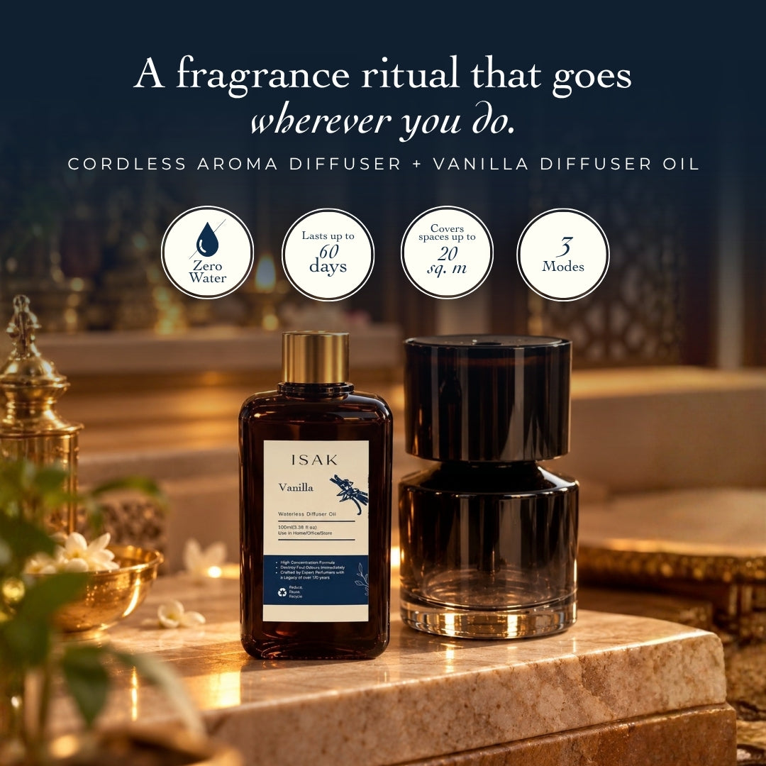 Cordless aroma diffuser base and vanilla fragrance oil bottle, glossy black top and amber glass