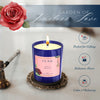 Blue glass scented candle with rose label and burning wick flame