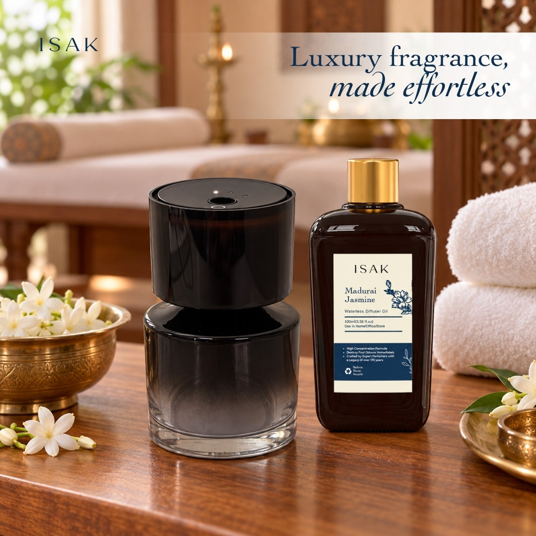 Cordless aroma oil diffuser with dark glass base and amber jasmine fragrance oil bottle