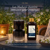 Cordless aroma oil diffuser with amber jasmine fragrance oil bottle and floral decor
