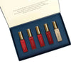 Love Note perfume set: five small bottles with gold caps in a blue gift box