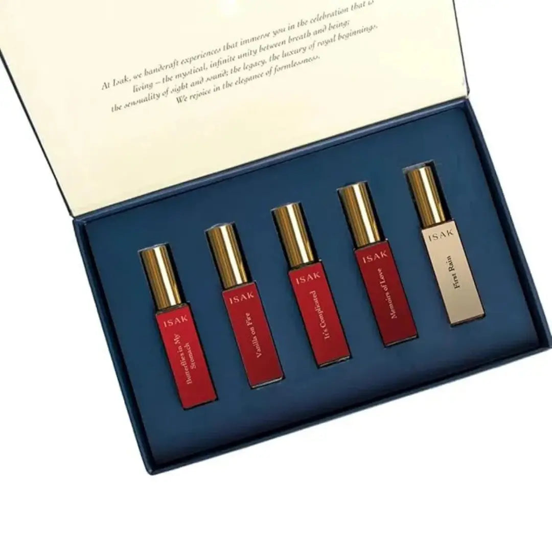 Love Note perfume set: five small bottles with gold caps in a blue gift box