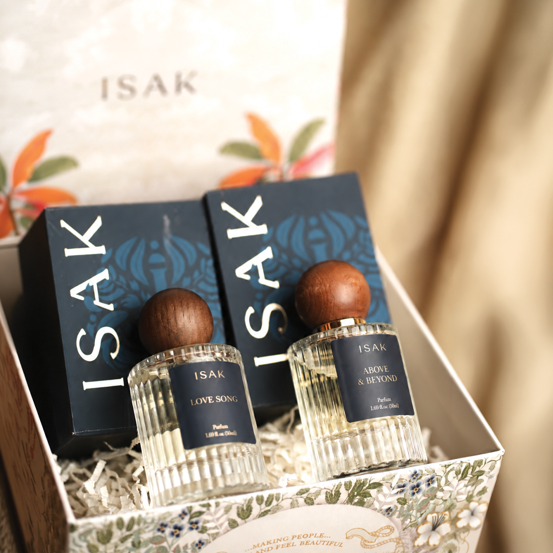 Gift set with two perfume bottles in blue labels, ISAK and Love Song tags