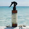 Fresh Waves air freshener spray bottle with black trigger, amber liquid