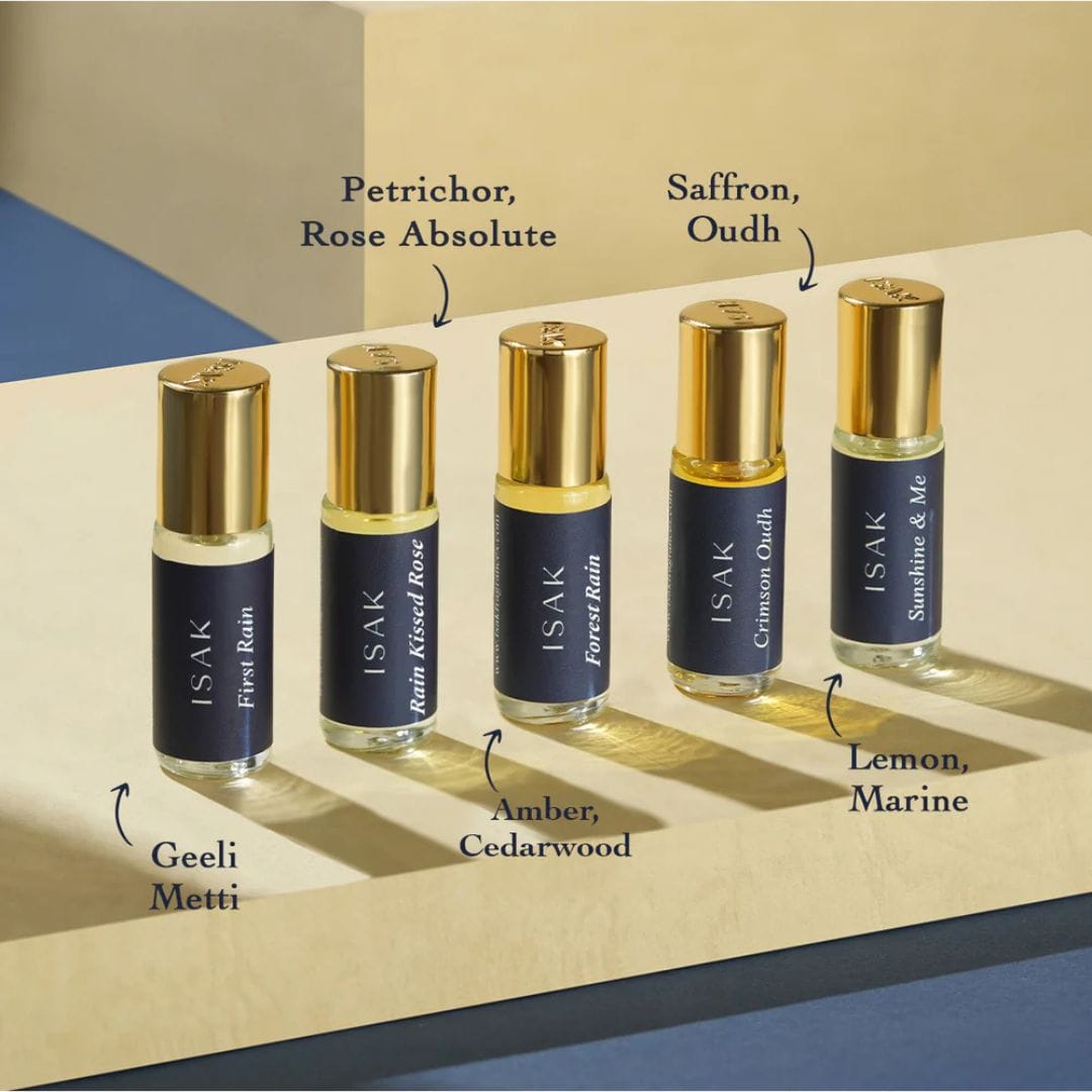 Discovery Pack Attars roll-on vials with gold caps arranged on display tray