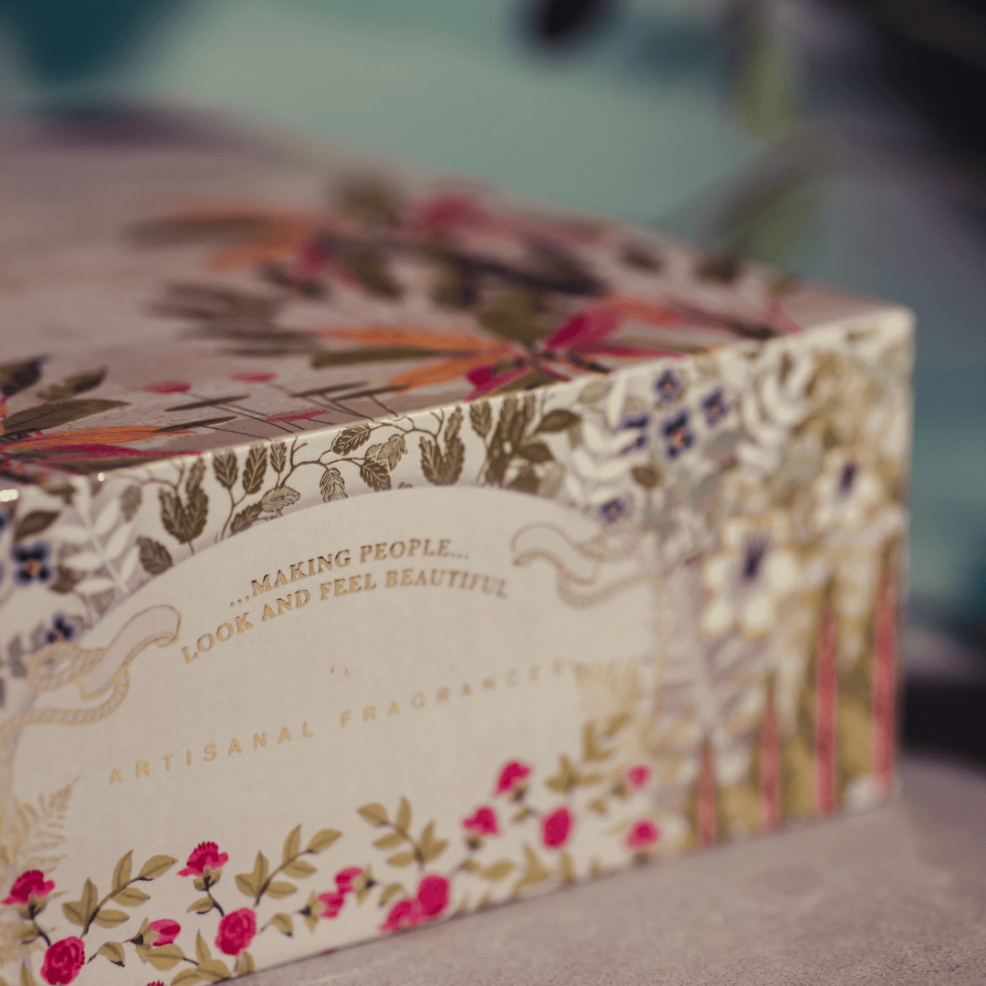 Gift Pack Perfumes Signature decorated box side with gold text and floral art